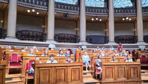 Діти українських захисників відвідали парламент Португалії