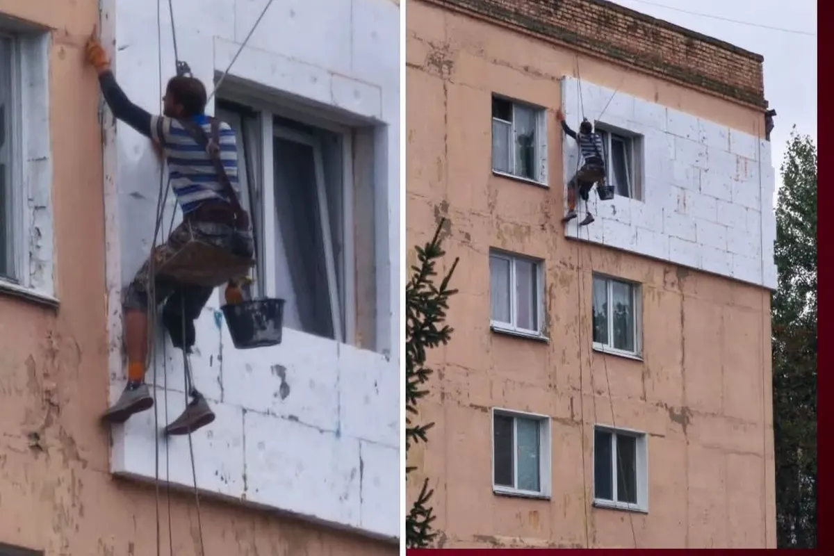 Чоловік із протезом утеплює фасад у Василькові: що стоїть за фото, яке облетіло мережу